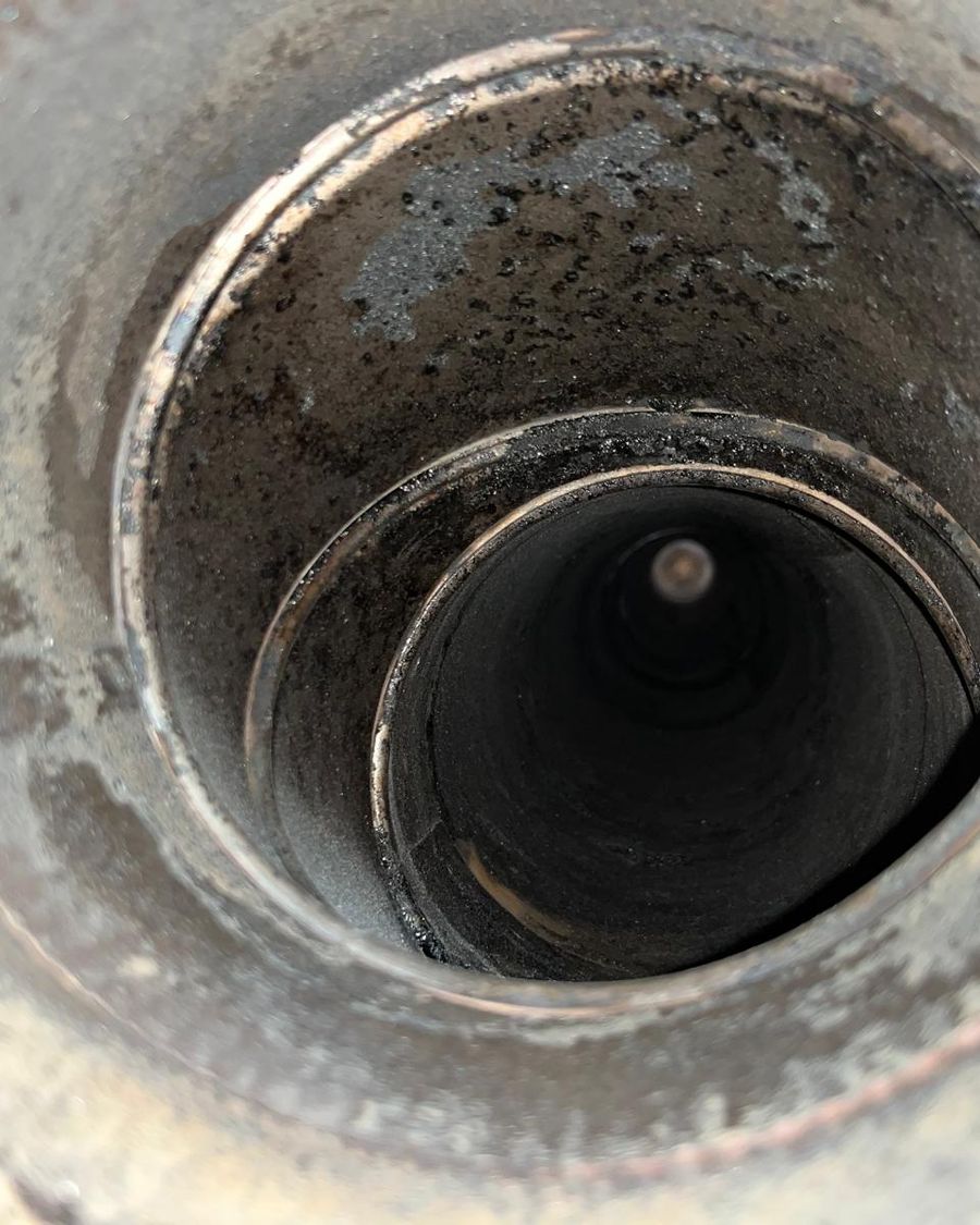 View straight down a stainless steel chimney flue liner