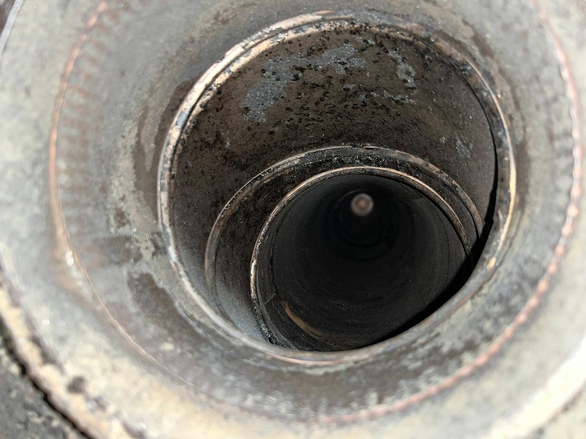 View straight down a stainless steel chimney flue liner